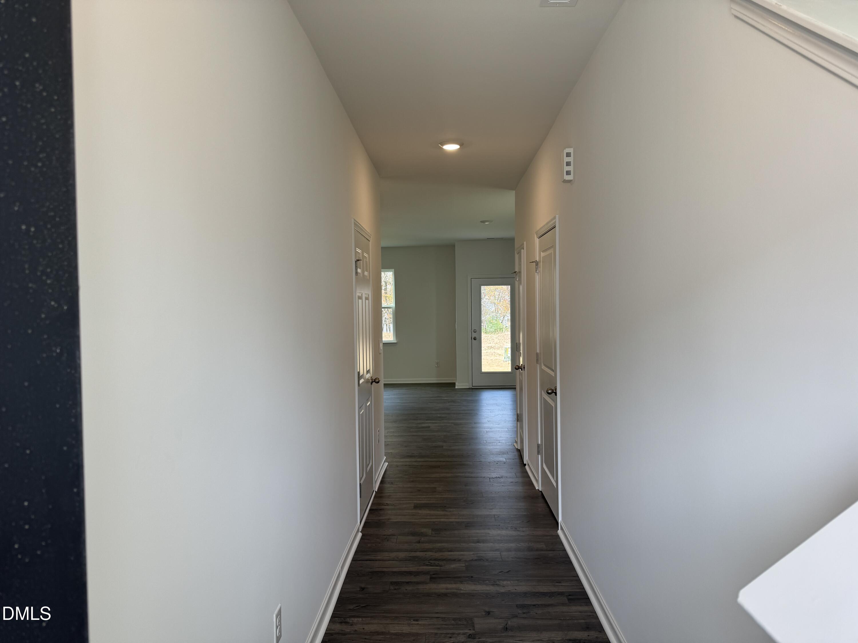 419 Belgian Red Way Wake Forest, NC 27587 - Photo 2 of 18 a view of a hallway with wooden floor
