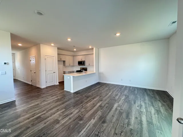 a view of kitchen with wooden floor