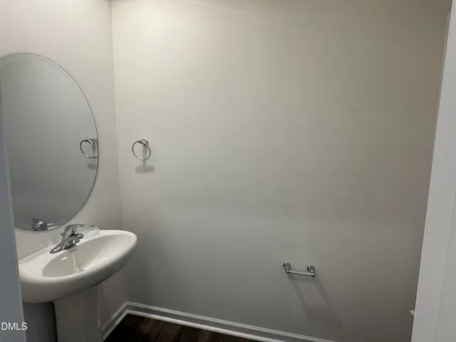a bathroom with a sink and mirror