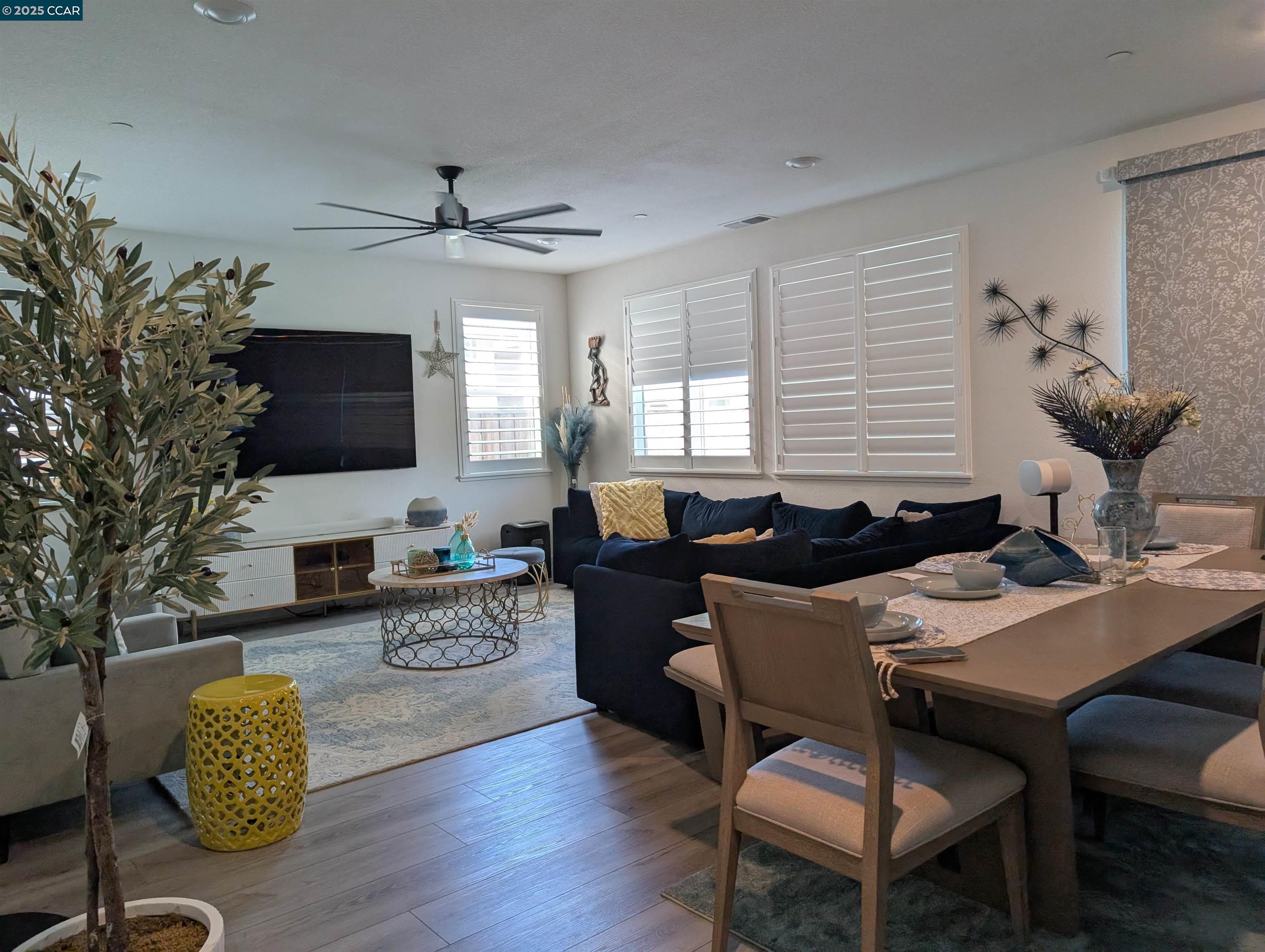 433 Ramos Ranch Road Oakley, CA 94561 - Photo 13 of 25 a living room with furniture a flat screen tv and a window