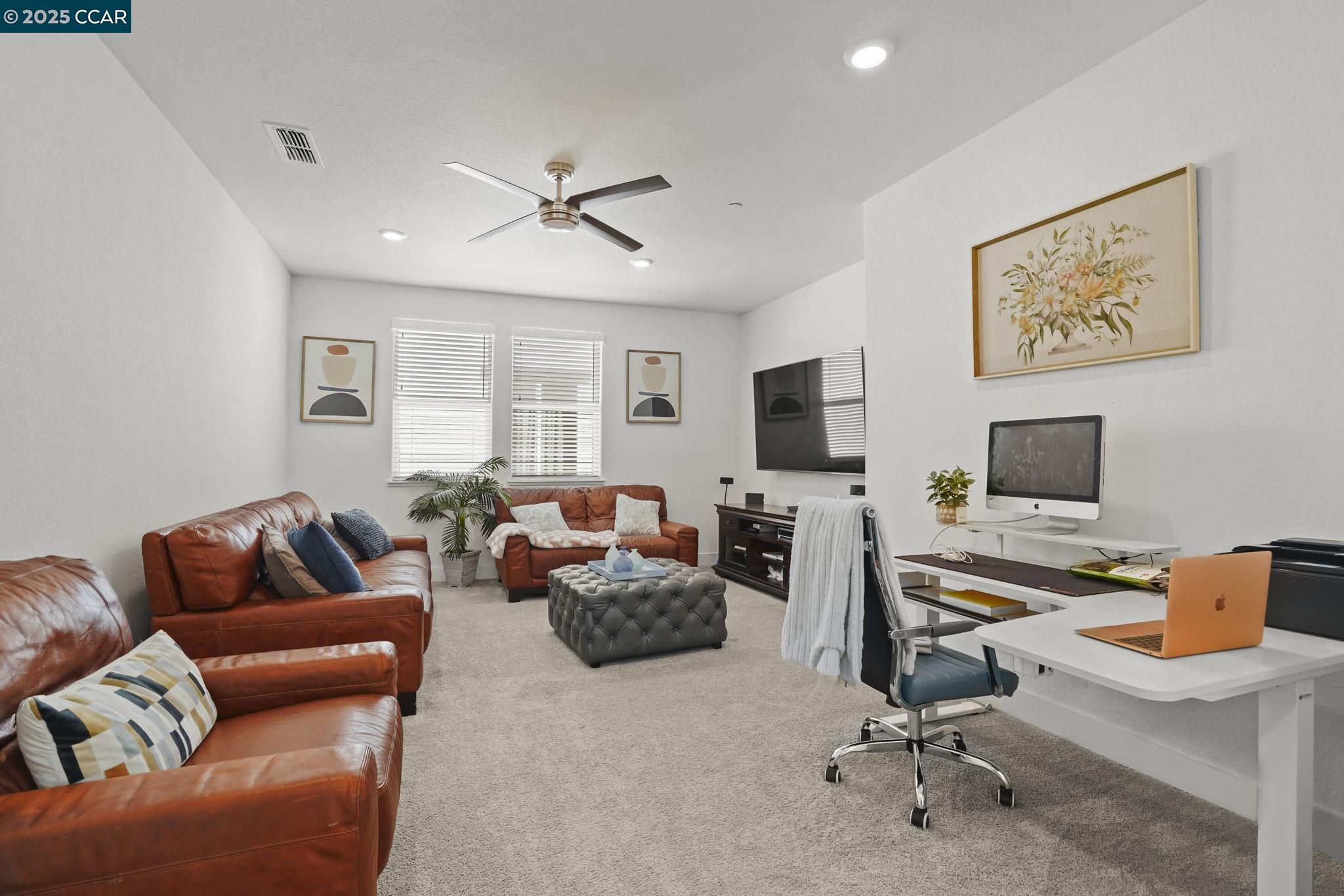 433 Ramos Ranch Road Oakley, CA 94561 - Photo 15 of 25 a living room with furniture and a flat screen tv
