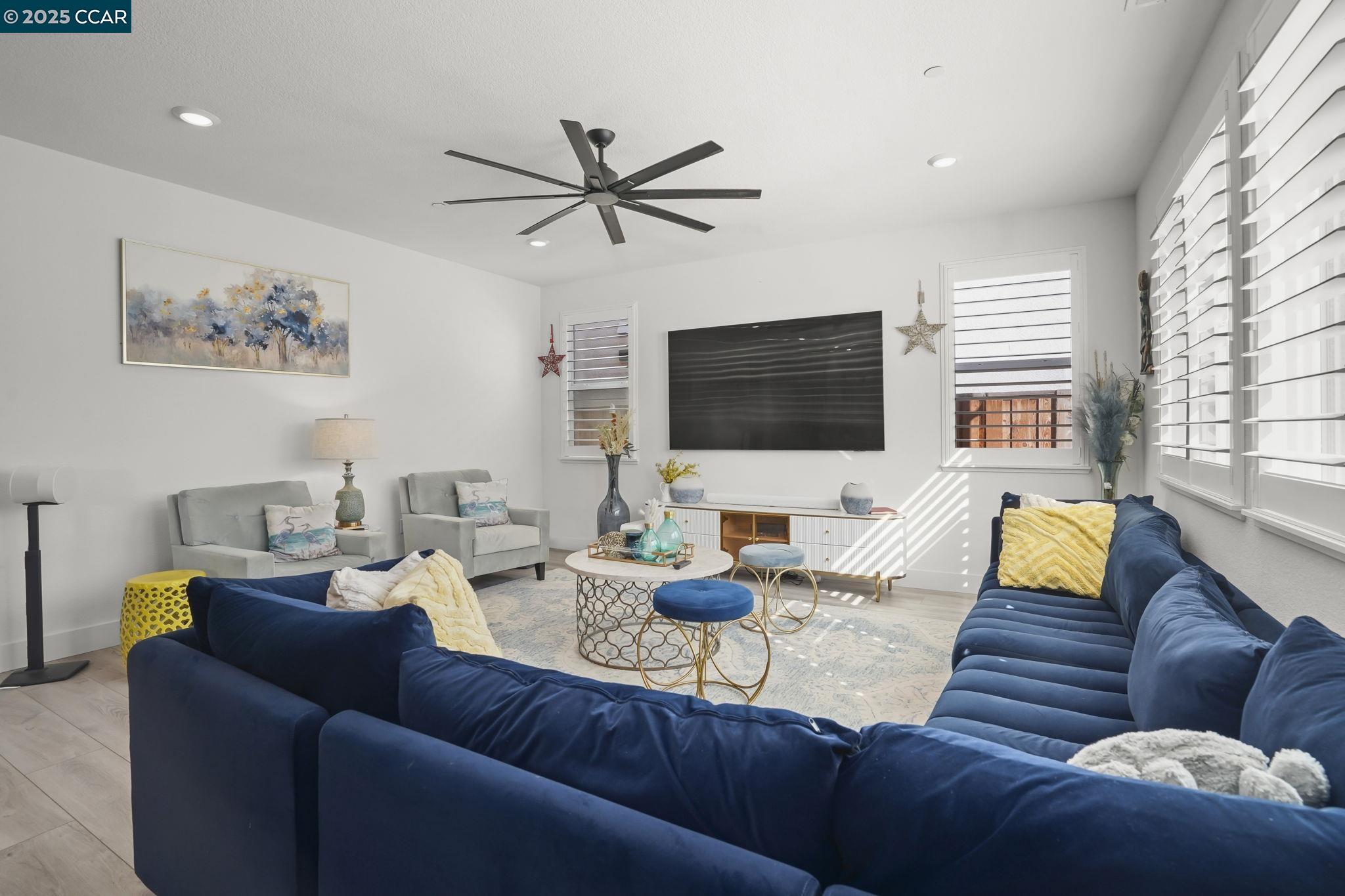 433 Ramos Ranch Road Oakley, CA 94561 - Photo 4 of 25 a living room with furniture and a flat screen tv