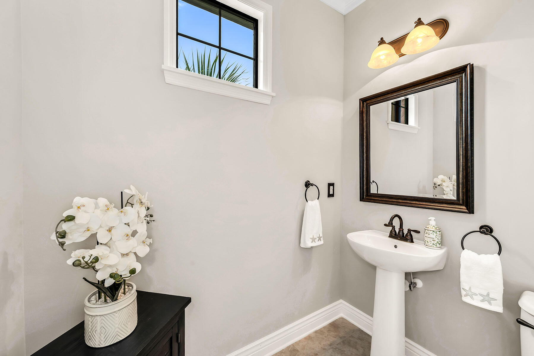 9066 Albion Lane North, Unit 5101 Naples, FL 34113 - Photo 17 of 48 a bathroom with a sink and a mirror