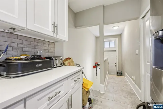 a kitchen with a stove and a refrigerator