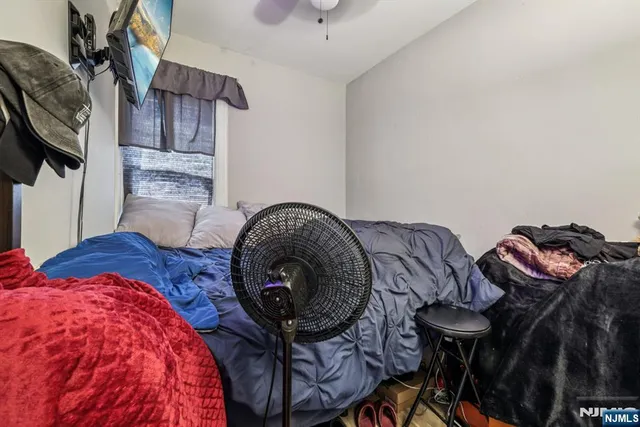 a bedroom with furniture and a bed