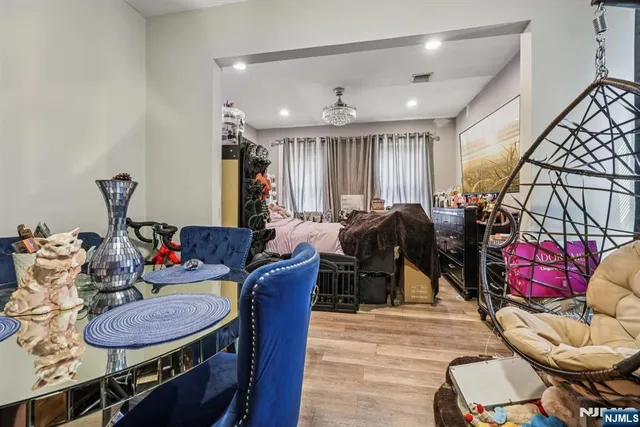 a living room with furniture a couch and a chandelier