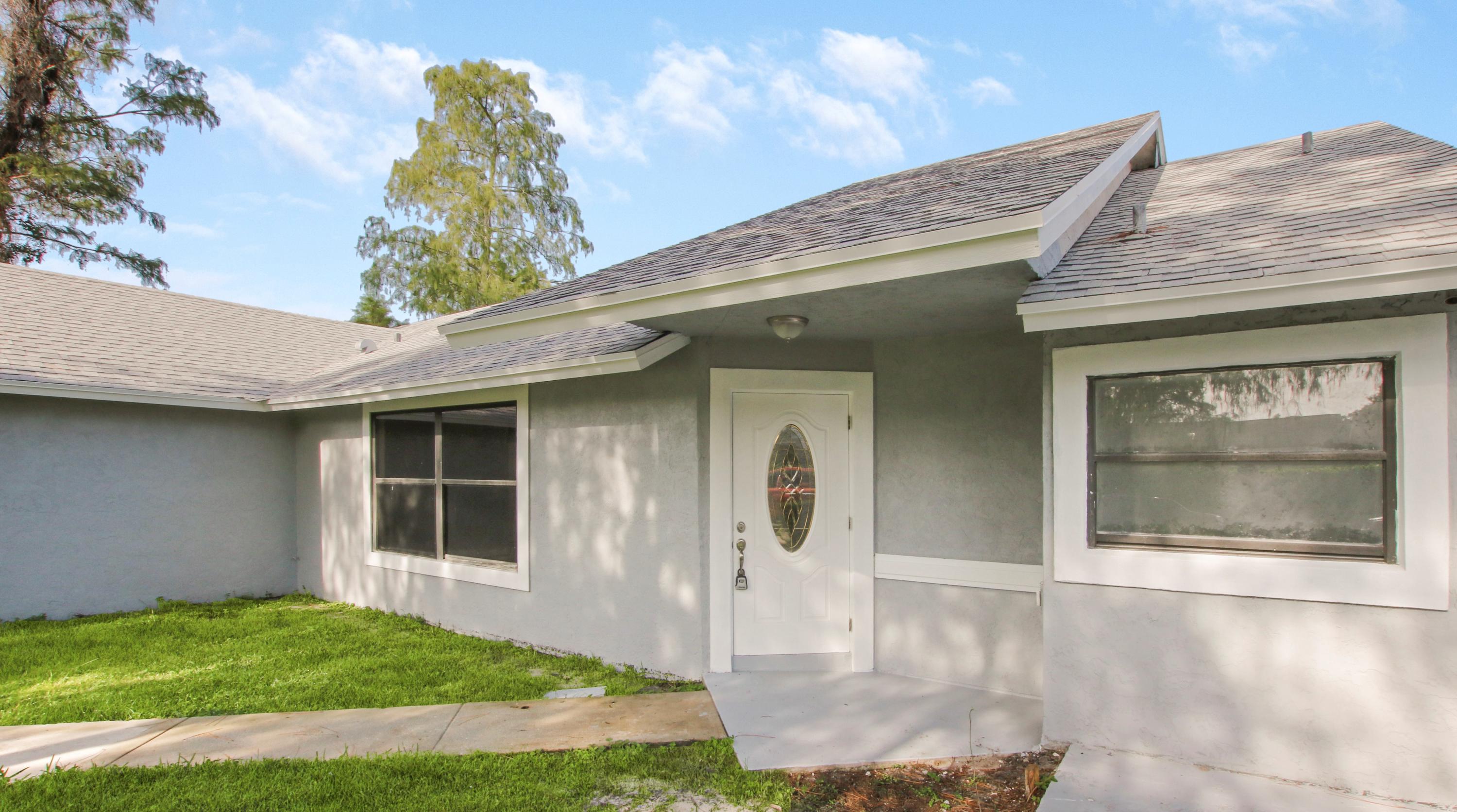 1252 Raintree Lane Wellington, FL 33414 - Photo 2 of 22 front door