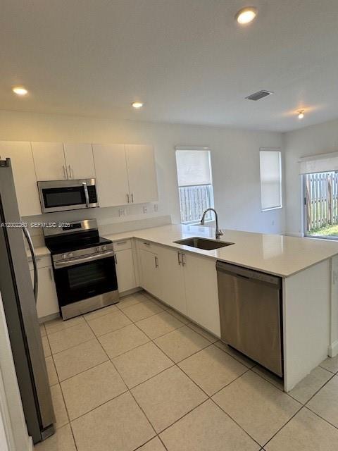 16283 Southwest 292nd Street Homestead, FL 33033 - Photo 4 of 29 a kitchen with granite countertop a sink and white cabinets