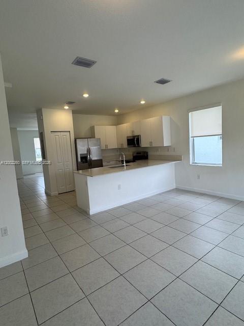 16283 Southwest 292nd Street Homestead, FL 33033 - Photo 6 of 29 a large kitchen with stainless steel appliances lots of counter space and cabinets