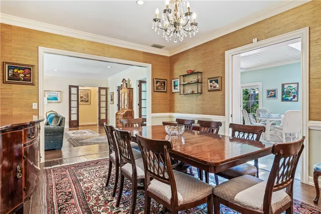a view of a dining room with furniture and window