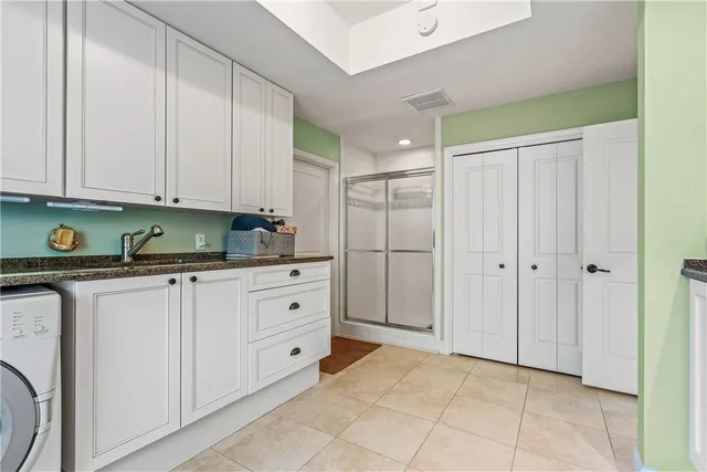a view of a dining room with furniture a chandelier and wooden floor