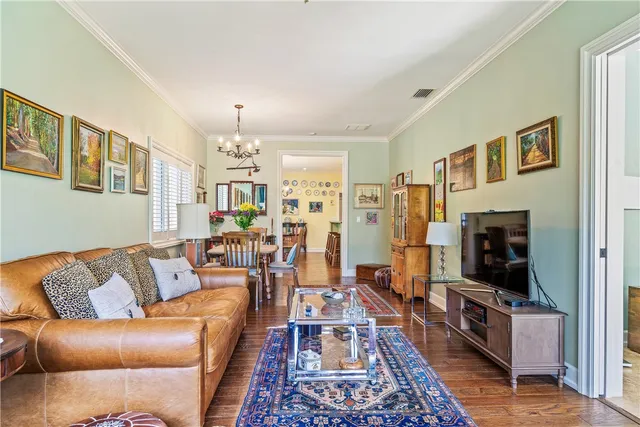 a dining room with furniture window and wooden floor
