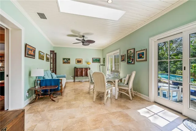 a view of a livingroom with furniture and a large window