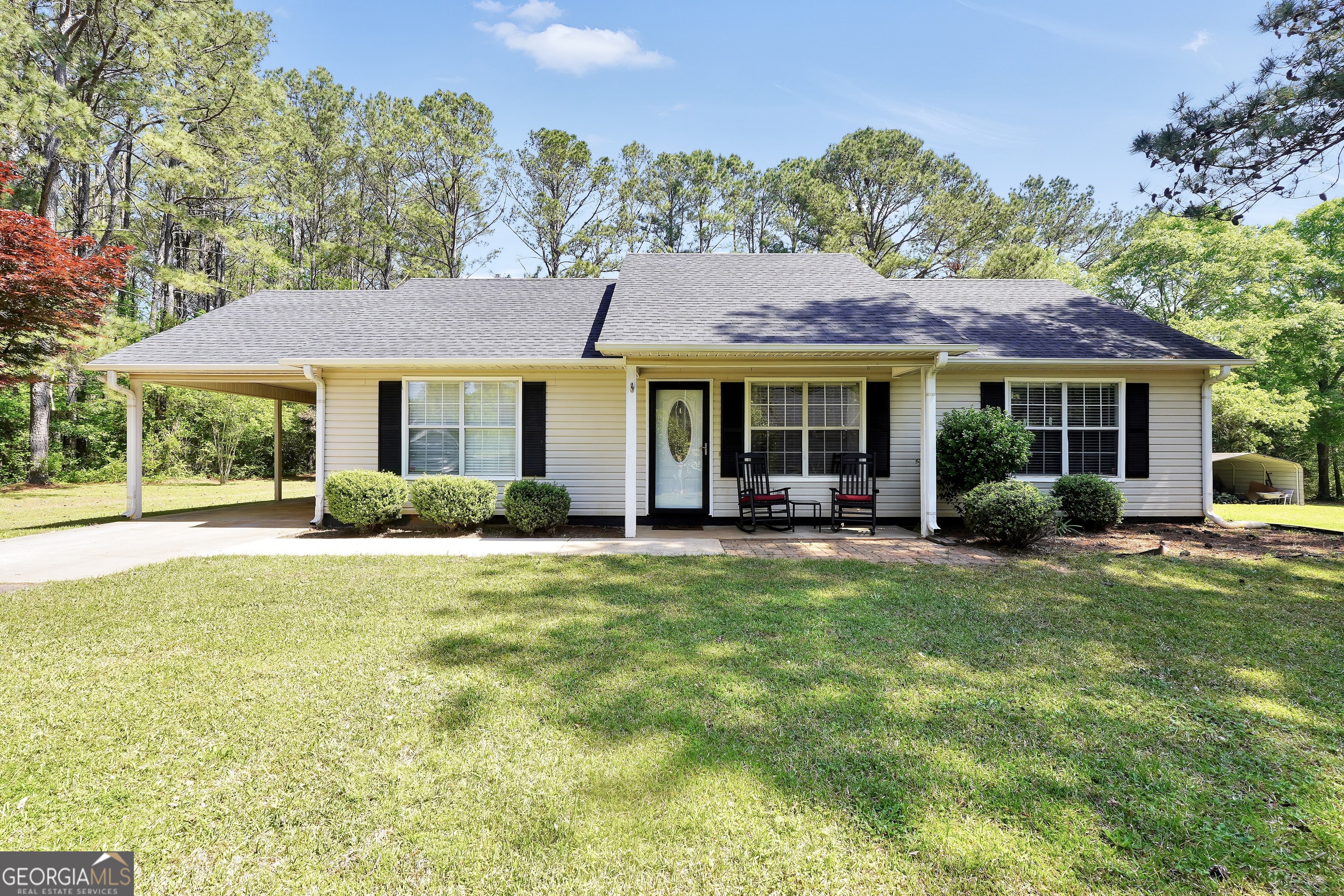 154 Salter Road Thomaston, GA 30286 - Photo 1 of 1 a view of a house with swimming pool and a yard