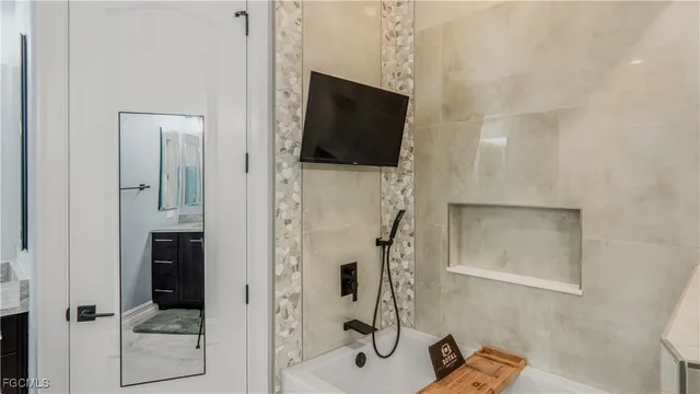 a bathroom with a shower and a mirror