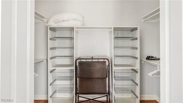 a kitchen with a refrigerator and more cabinets
