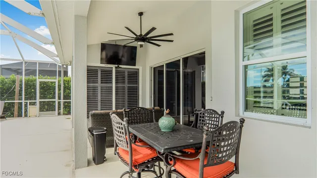a view of a house with a dining table and chairs