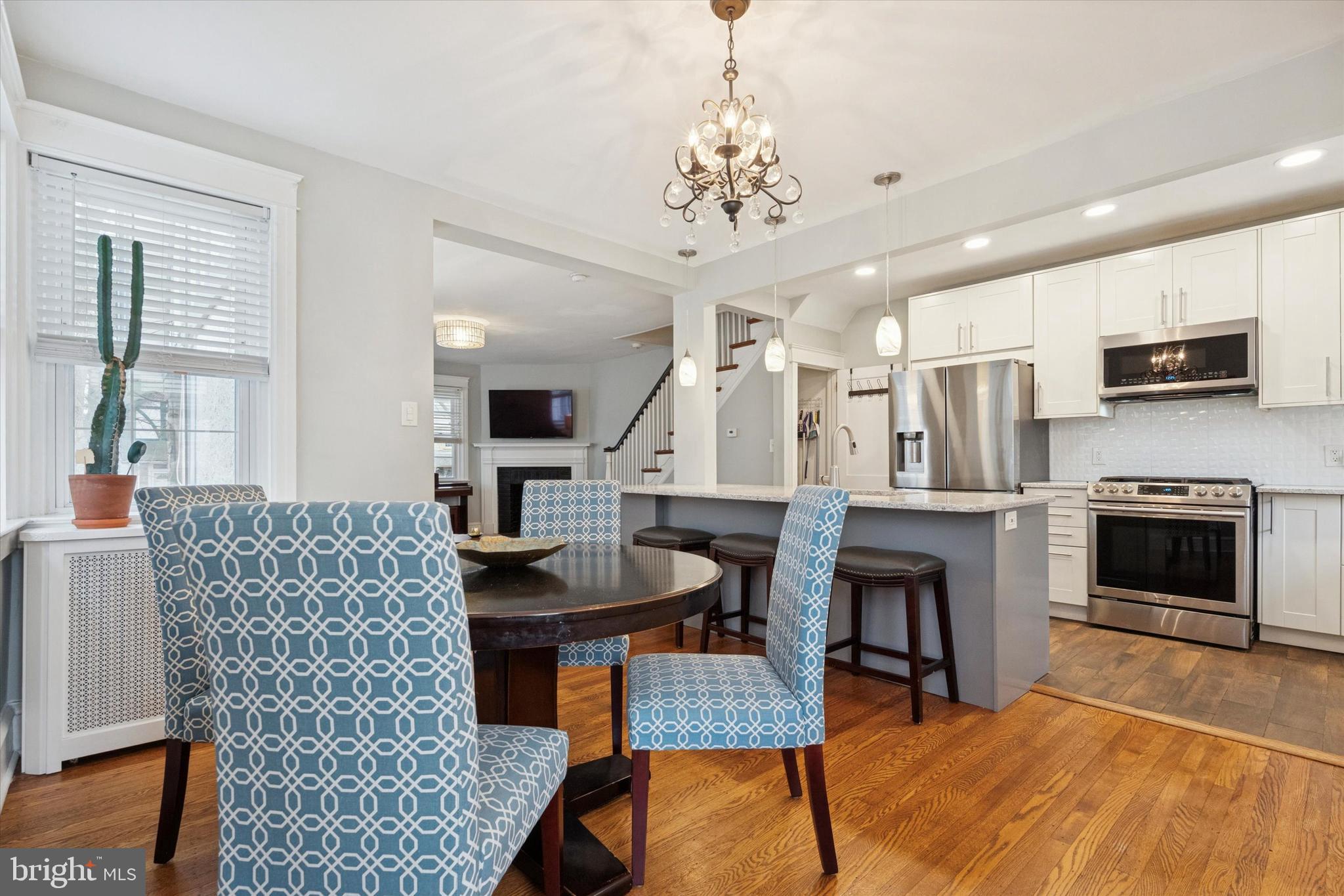 28 Chatham Road Ardmore, PA 19003 - Photo 14 of 32 a living room with furniture a fireplace and a flat screen tv