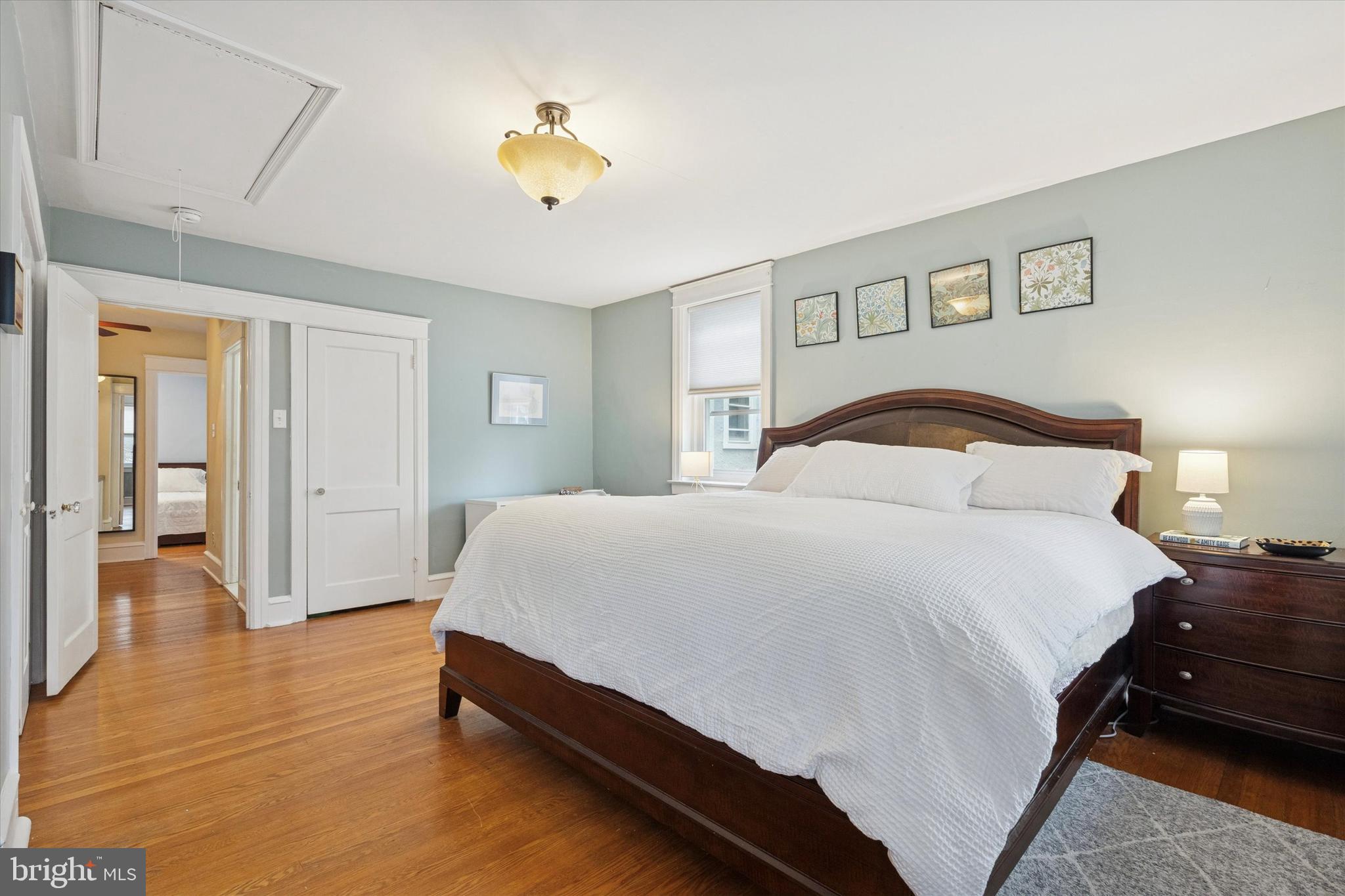 28 Chatham Road Ardmore, PA 19003 - Photo 17 of 32 a bedroom with a bed and wooden floor