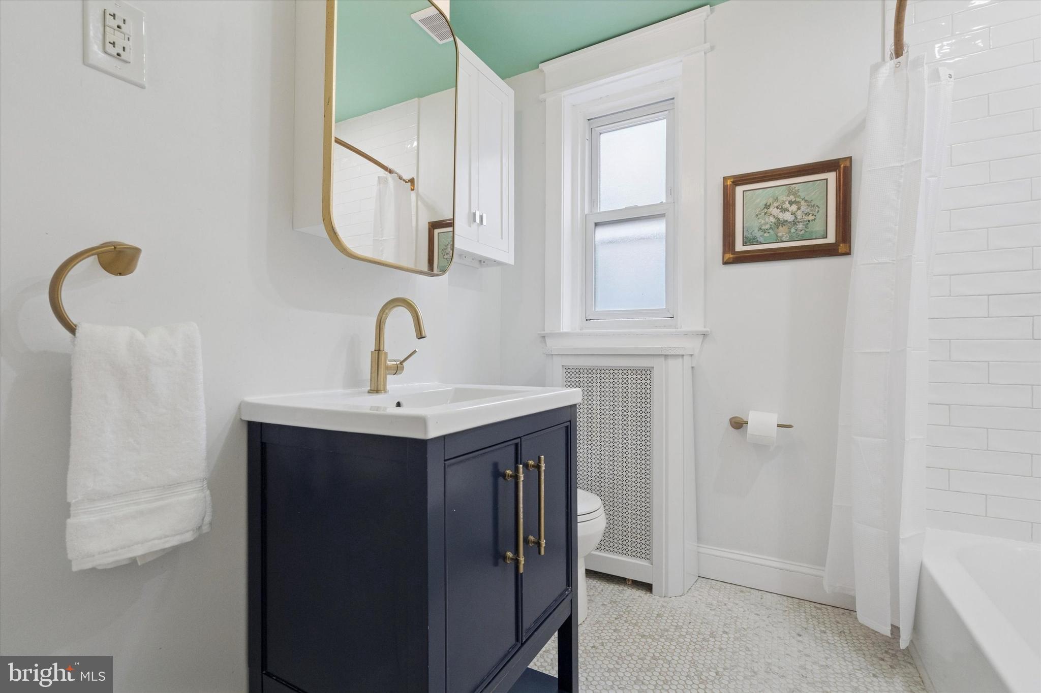 28 Chatham Road Ardmore, PA 19003 - Photo 18 of 32 a bathroom with a sink and mirror