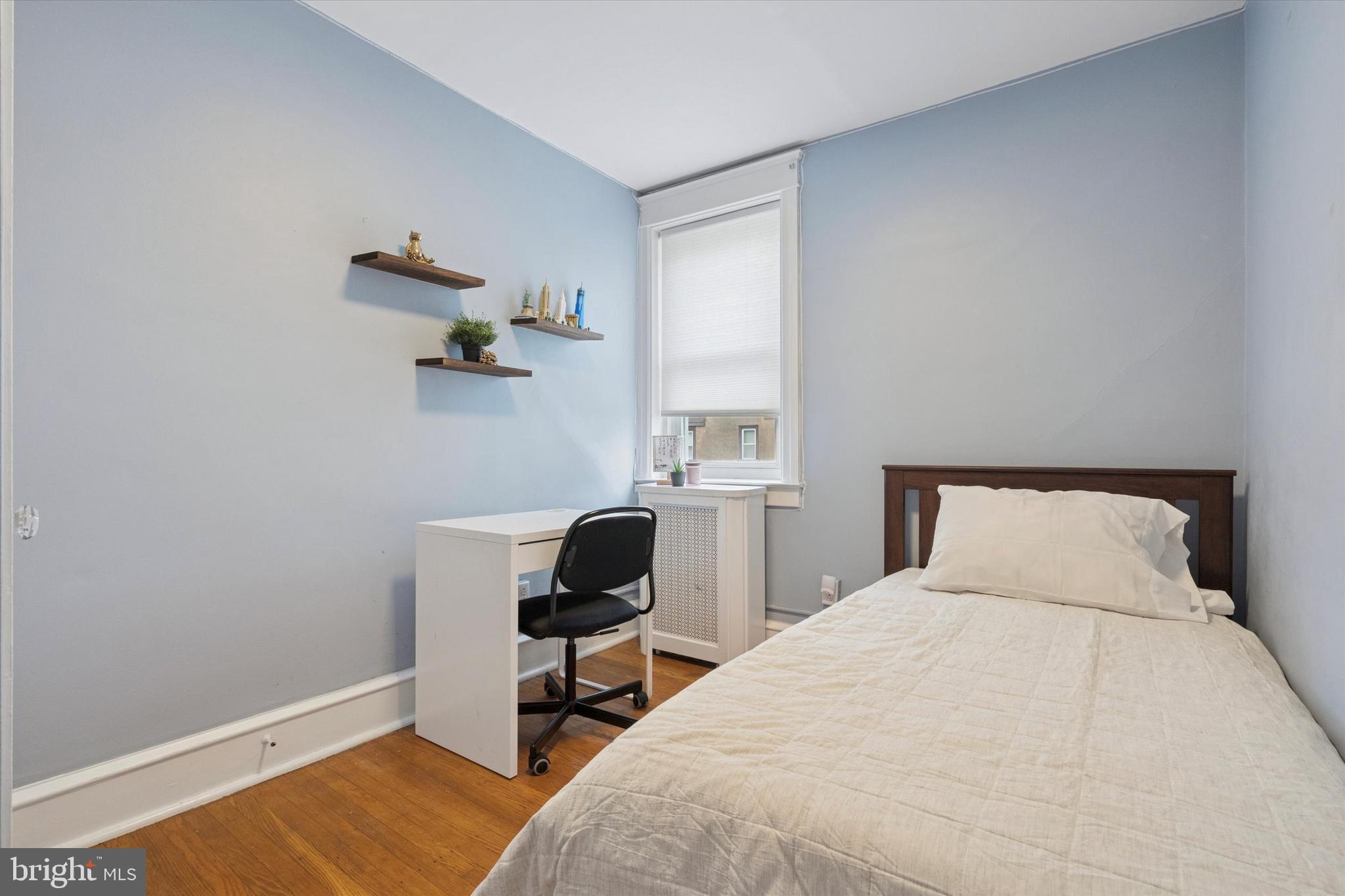 28 Chatham Road Ardmore, PA 19003 - Photo 24 of 32 a bedroom with a bed a table and chair