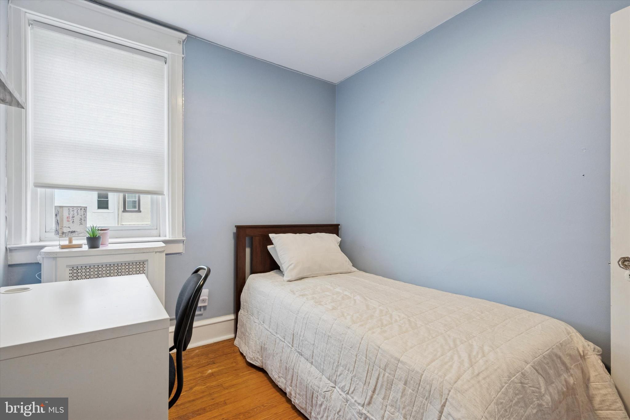 28 Chatham Road Ardmore, PA 19003 - Photo 25 of 32 a bedroom with a bed and a table in it