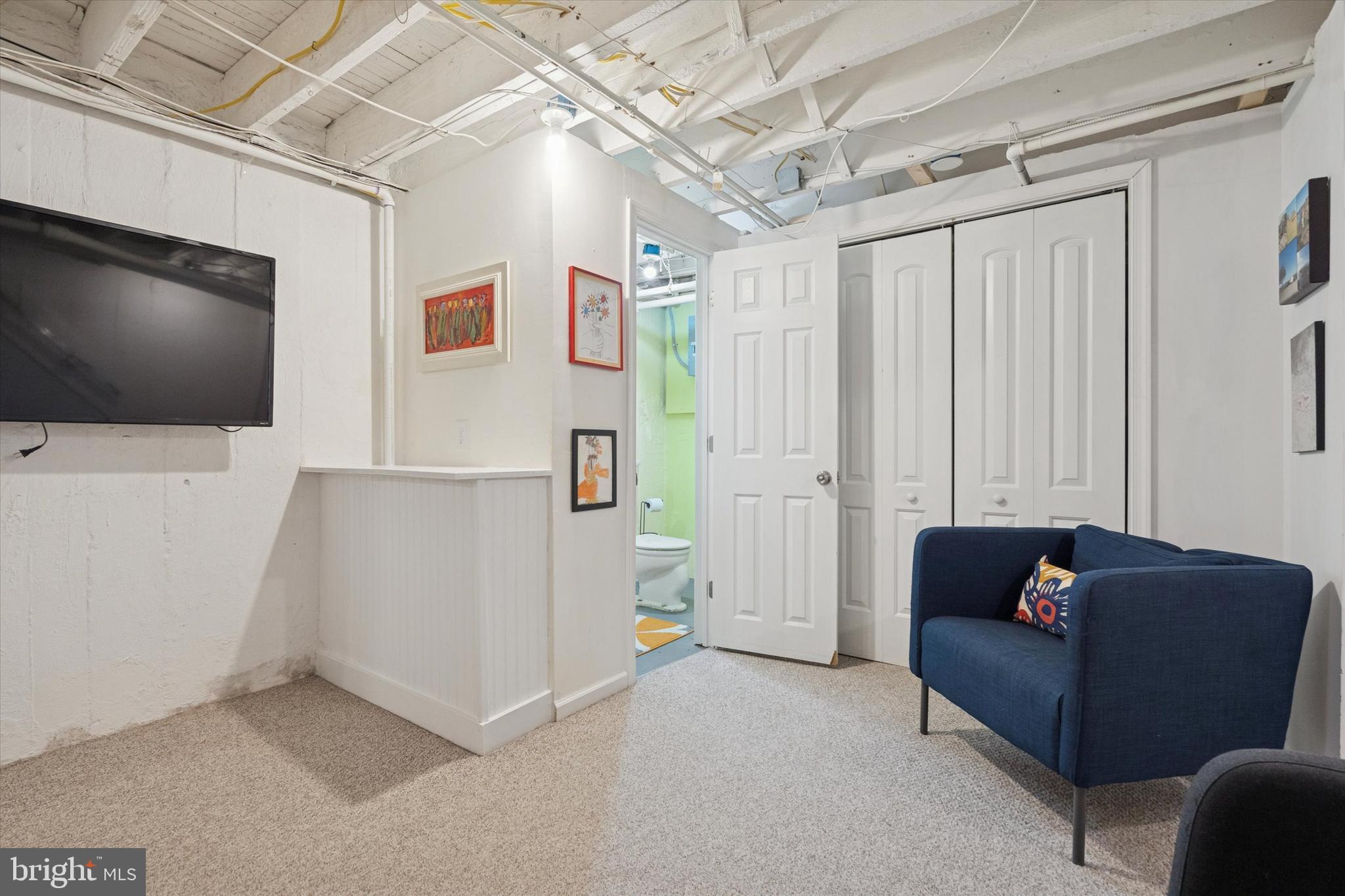 28 Chatham Road Ardmore, PA 19003 - Photo 27 of 32 a living room with furniture and a flat screen tv