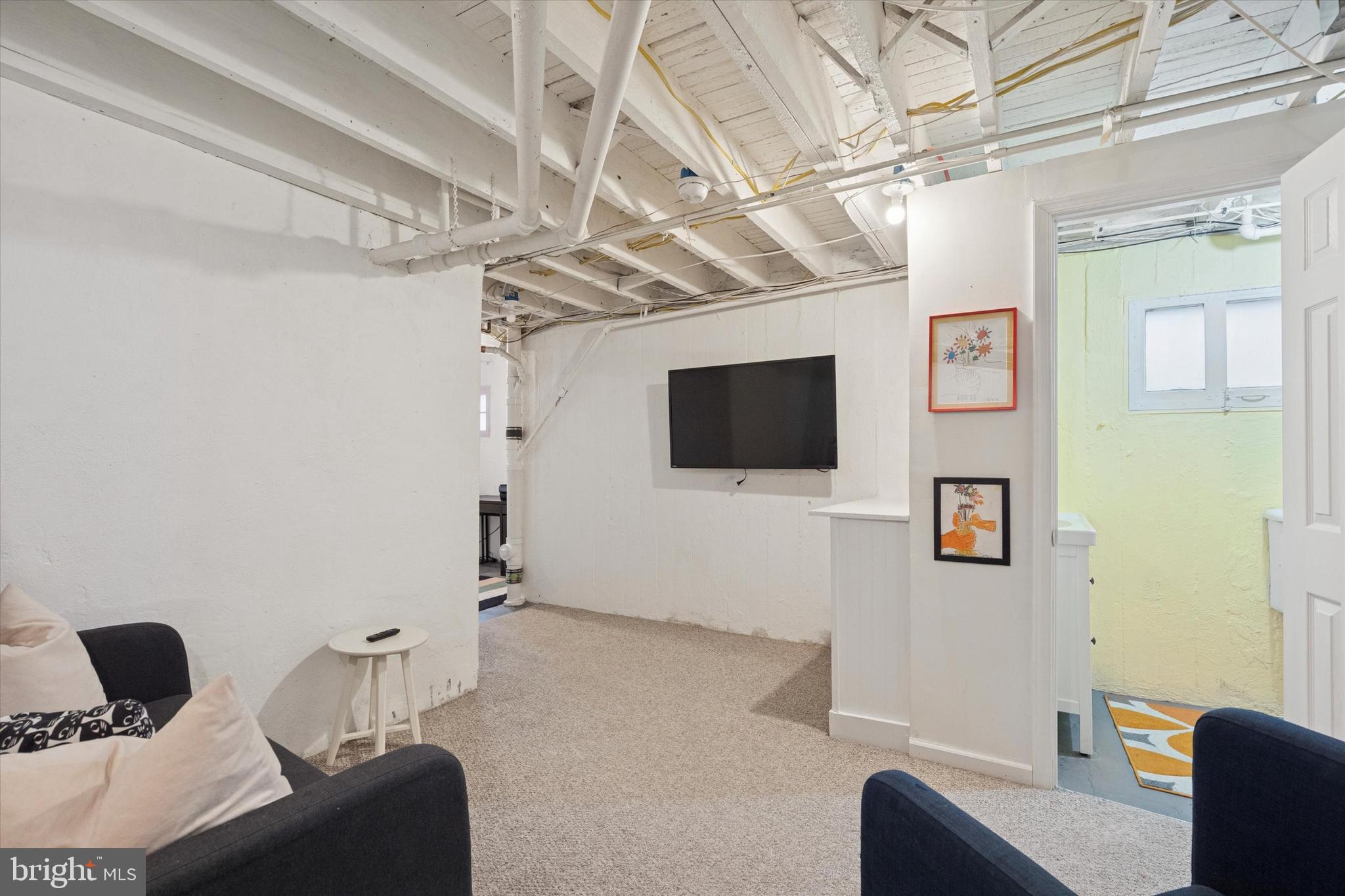 28 Chatham Road Ardmore, PA 19003 - Photo 28 of 32 a living room with furniture and a flat screen tv