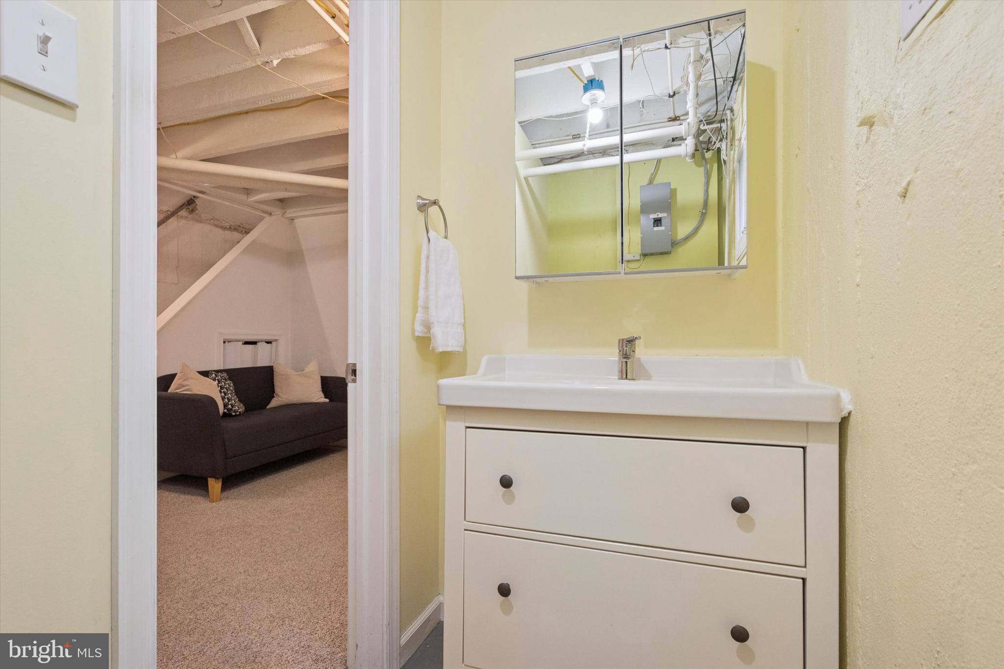 28 Chatham Road Ardmore, PA 19003 - Photo 30 of 32 a bathroom with a sink and a mirror