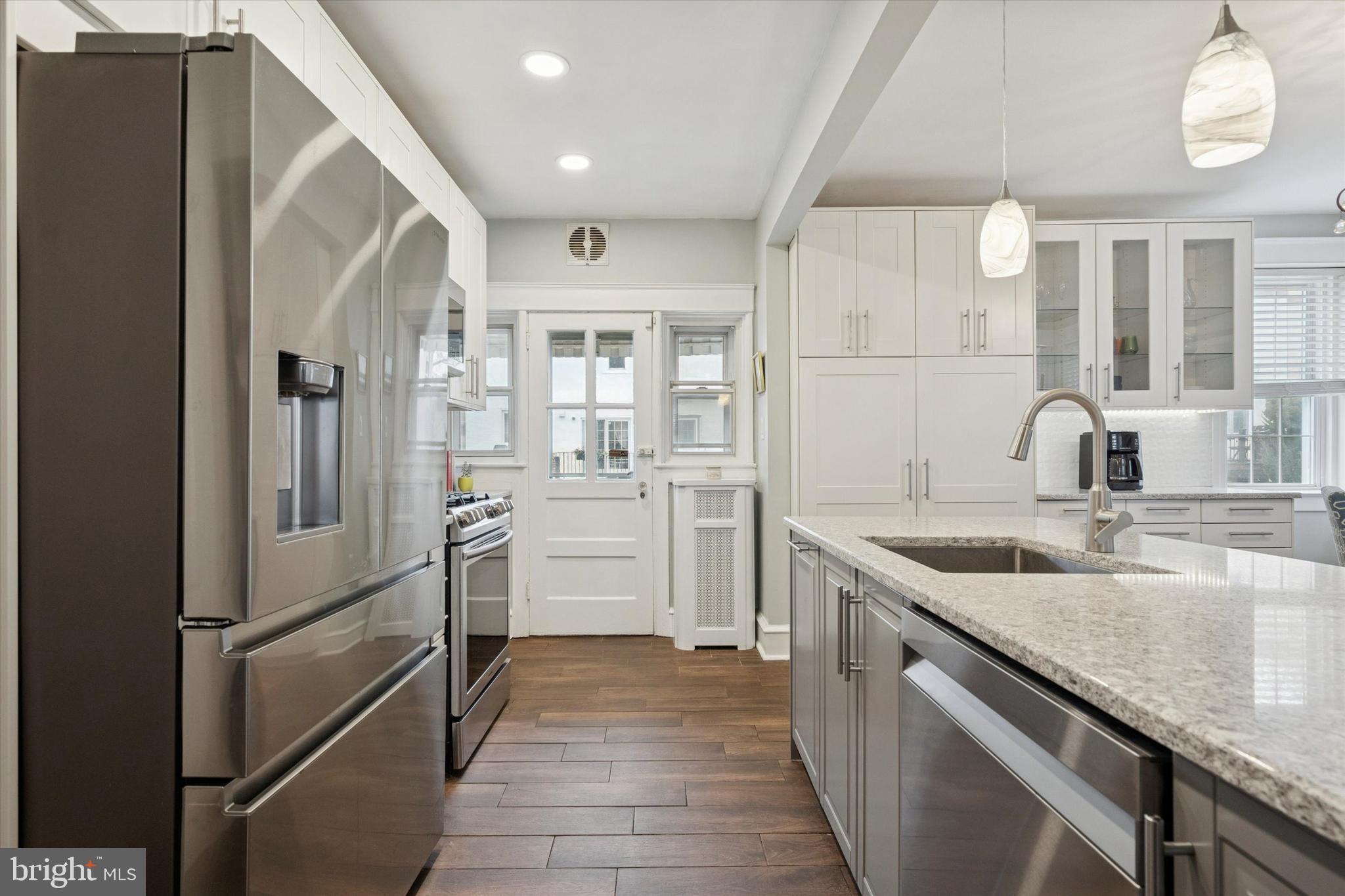 28 Chatham Road Ardmore, PA 19003 - Photo 10 of 32 a kitchen with a sink appliances and cabinets