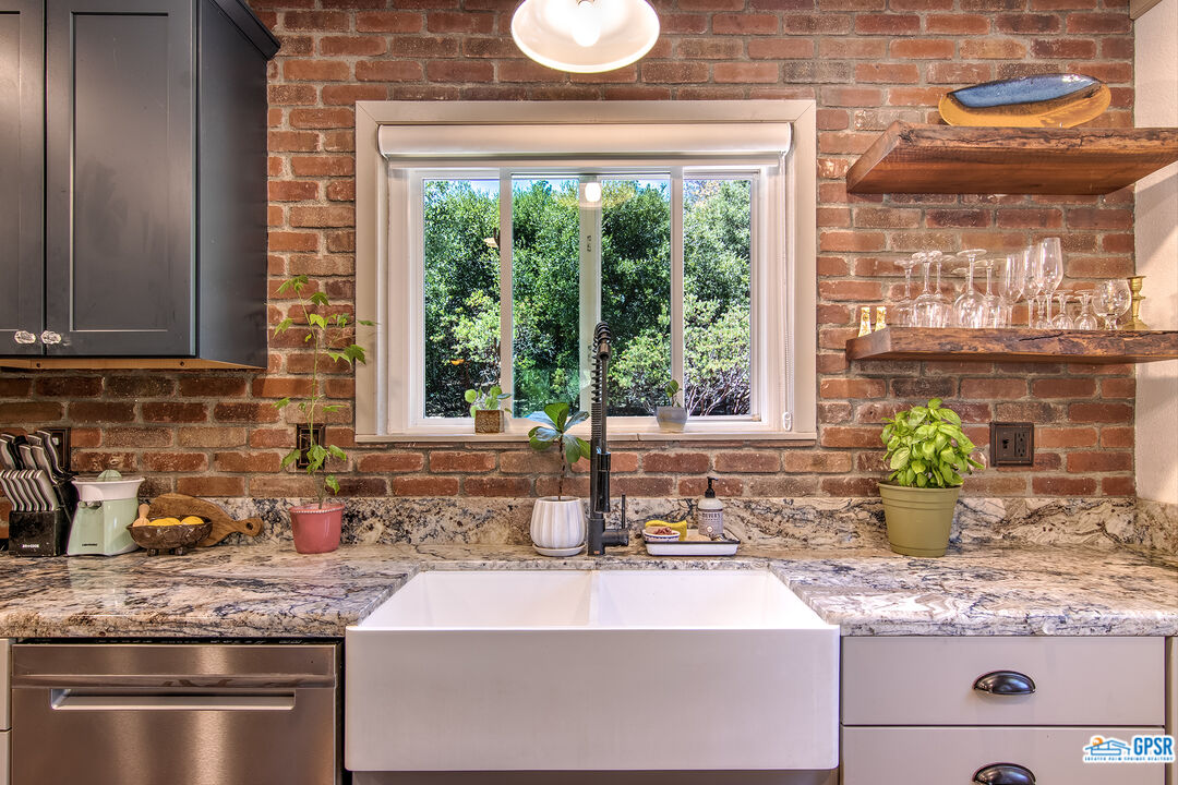 25527 Cedar Glen Drive Idyllwild, CA 92549 - Photo 11 of 69 a kitchen with granite countertop a sink and a window