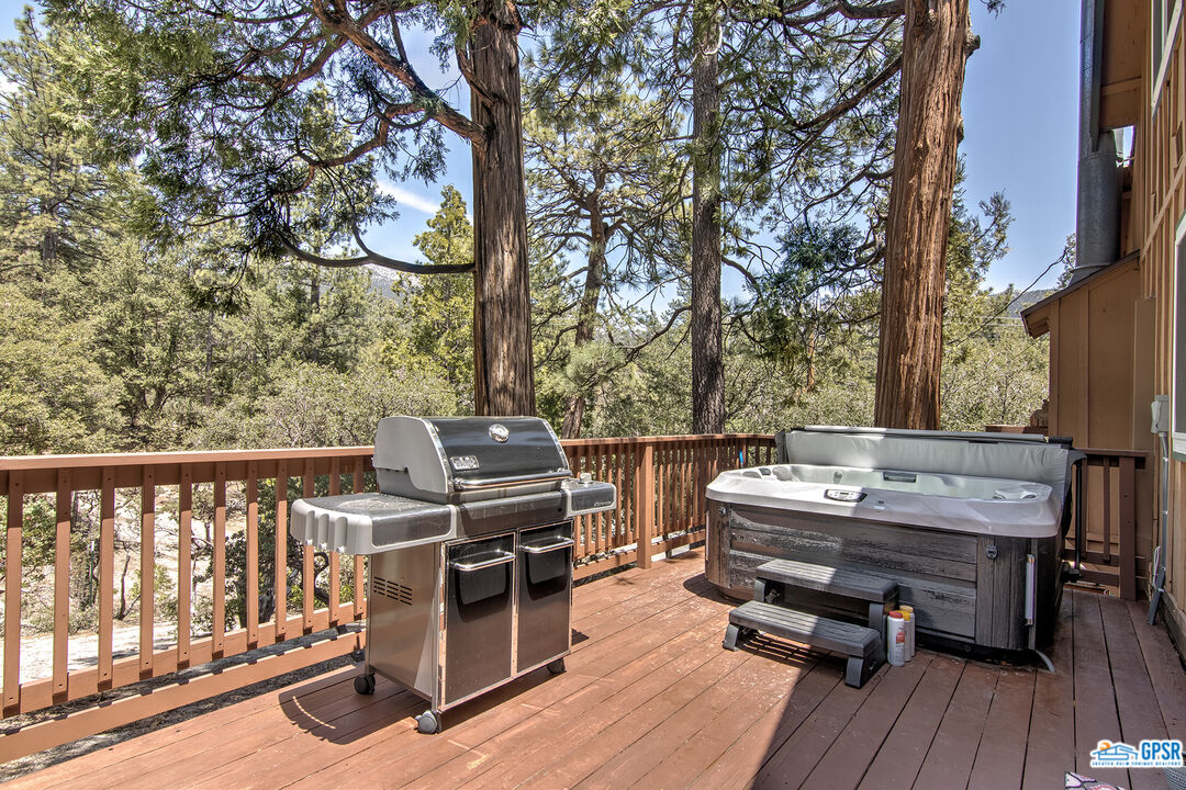 25527 Cedar Glen Drive Idyllwild, CA 92549 - Photo 14 of 69 a view of a balcony with wooden floor and outdoor seating