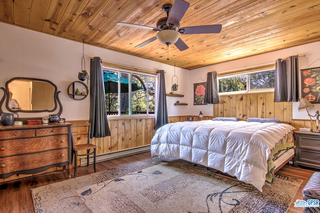 25527 Cedar Glen Drive Idyllwild, CA 92549 - Photo 17 of 69 a bedroom with a large bed and a dresser