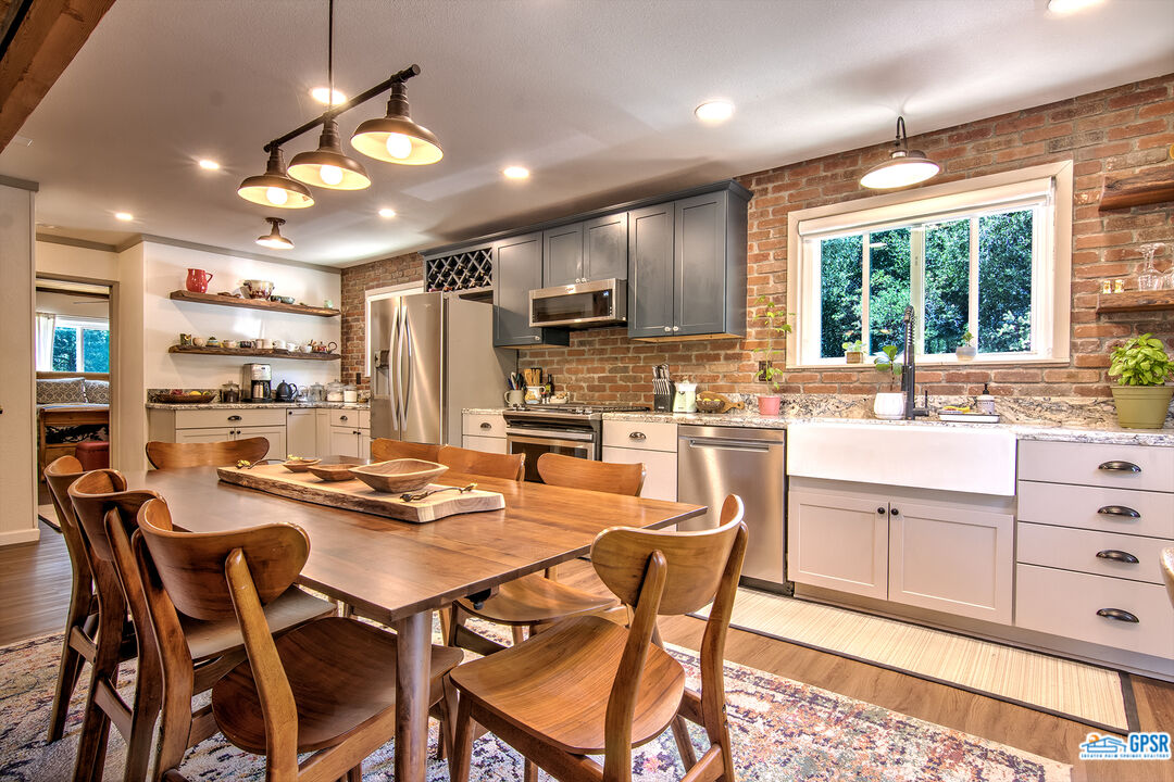 25527 Cedar Glen Drive Idyllwild, CA 92549 - Photo 3 of 69 a kitchen with stainless steel appliances kitchen island granite countertop a sink and cabinets