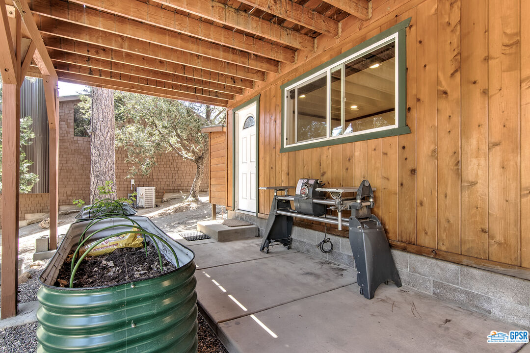 25527 Cedar Glen Drive Idyllwild, CA 92549 - Photo 35 of 69 a bed sitting in a bedroom next to a window