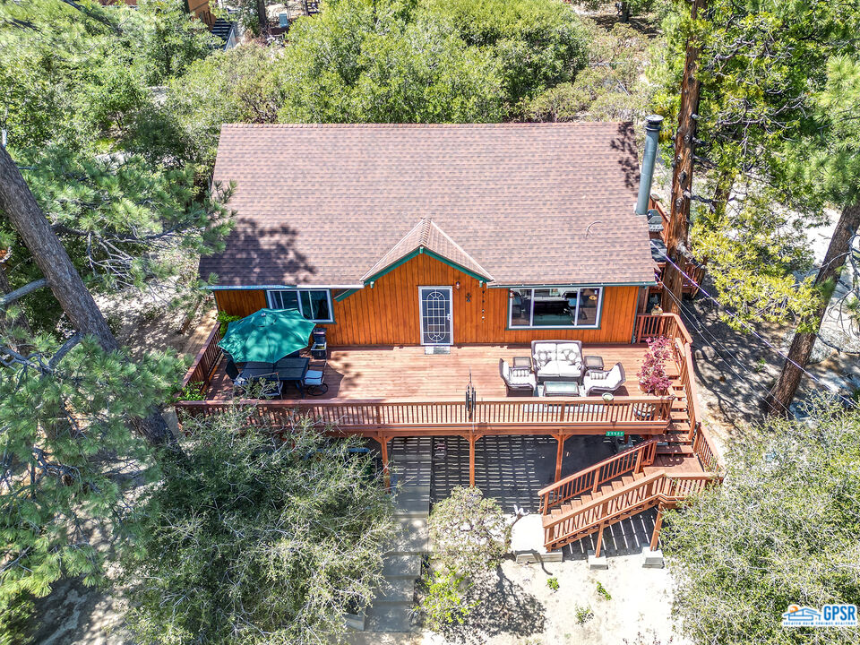 25527 Cedar Glen Drive Idyllwild, CA 92549 - Photo 37 of 69 an aerial view of a house with swimming pool and trees in the background