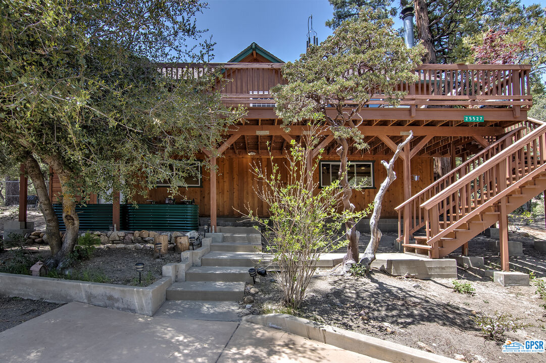 25527 Cedar Glen Drive Idyllwild, CA 92549 - Photo 40 of 69 a view of a tall building with large tree