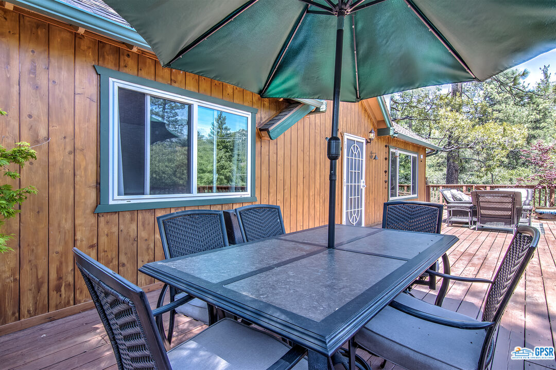 25527 Cedar Glen Drive Idyllwild, CA 92549 - Photo 42 of 69 an outdoor space with furniture and umbrella