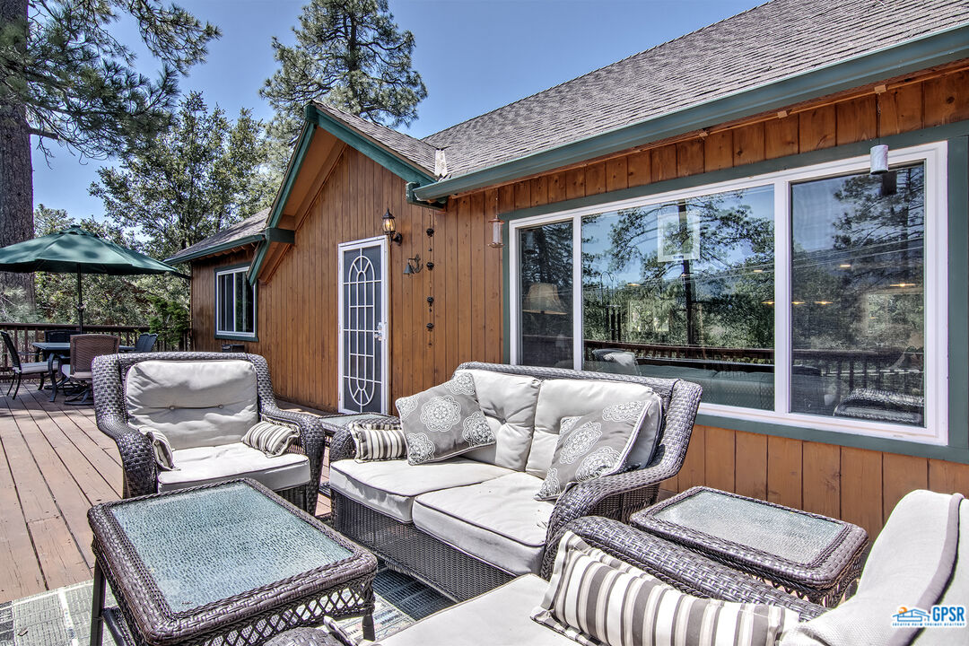 25527 Cedar Glen Drive Idyllwild, CA 92549 - Photo 5 of 69 a view of patio with couches table and chairs and potted plants