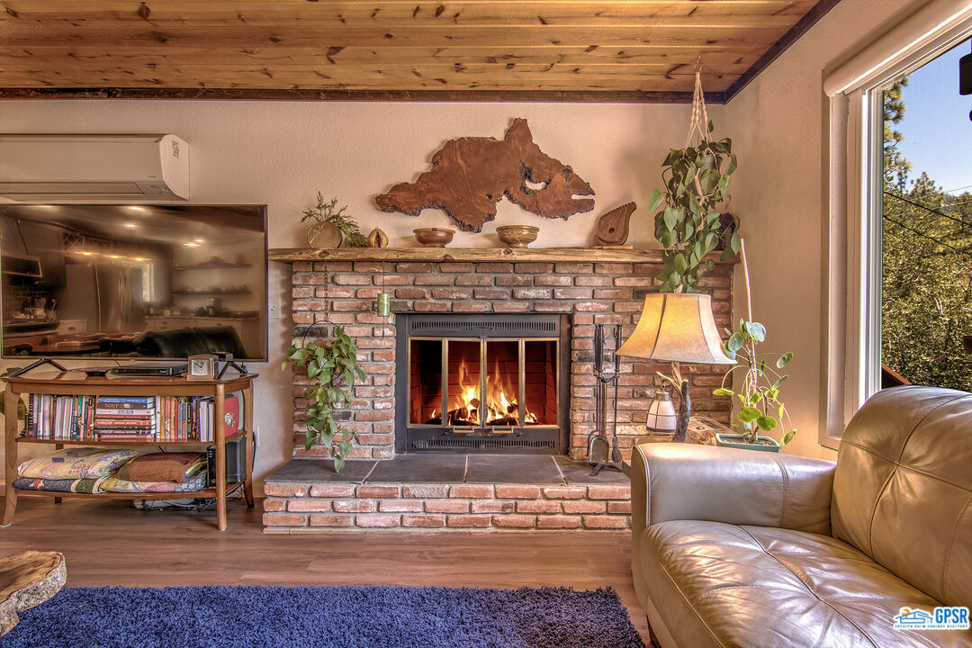 25527 Cedar Glen Drive Idyllwild, CA 92549 - Photo 51 of 69 a living room with furniture and a fireplace