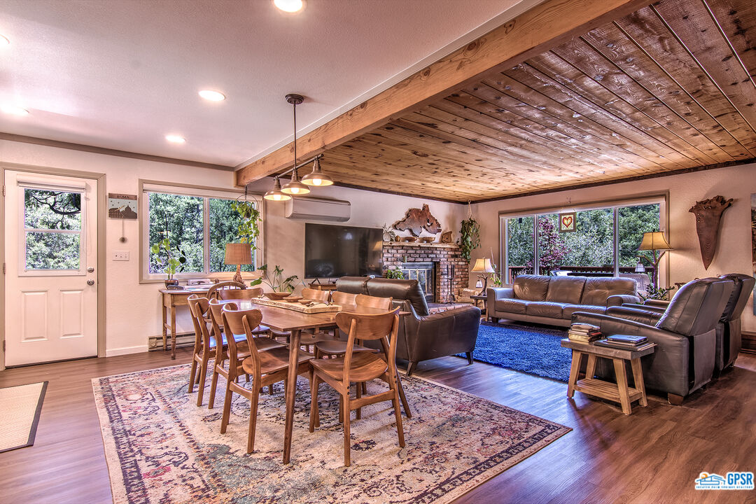 25527 Cedar Glen Drive Idyllwild, CA 92549 - Photo 55 of 69 a view of a dining room with furniture window and wooden floor