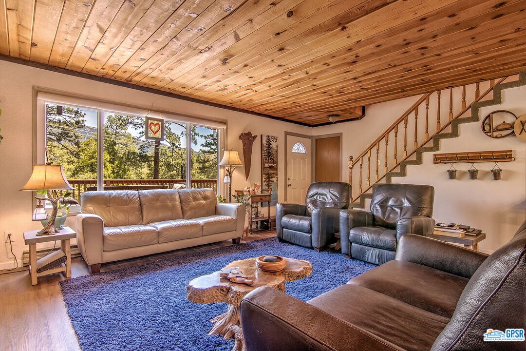 25527 Cedar Glen Drive Idyllwild, CA 92549 - Photo 10 of 69 a living room with furniture and a large window
