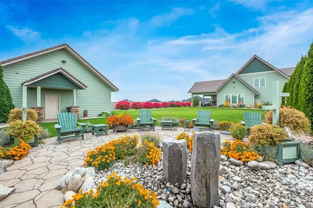 a front view of house with outdoor seating