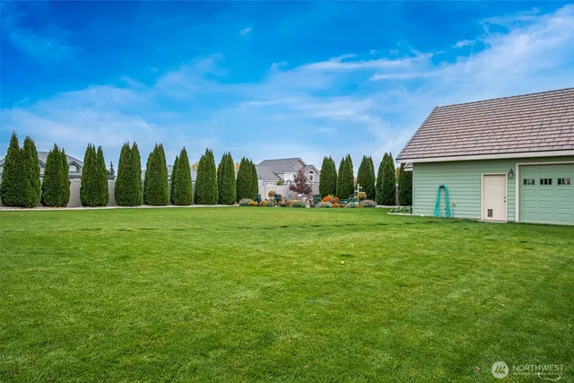 a view of a house with a big yard