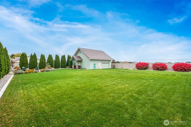 a front view of house with yard and green space