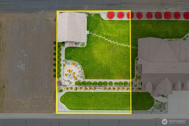 a view of swimming pool with a garden and plants