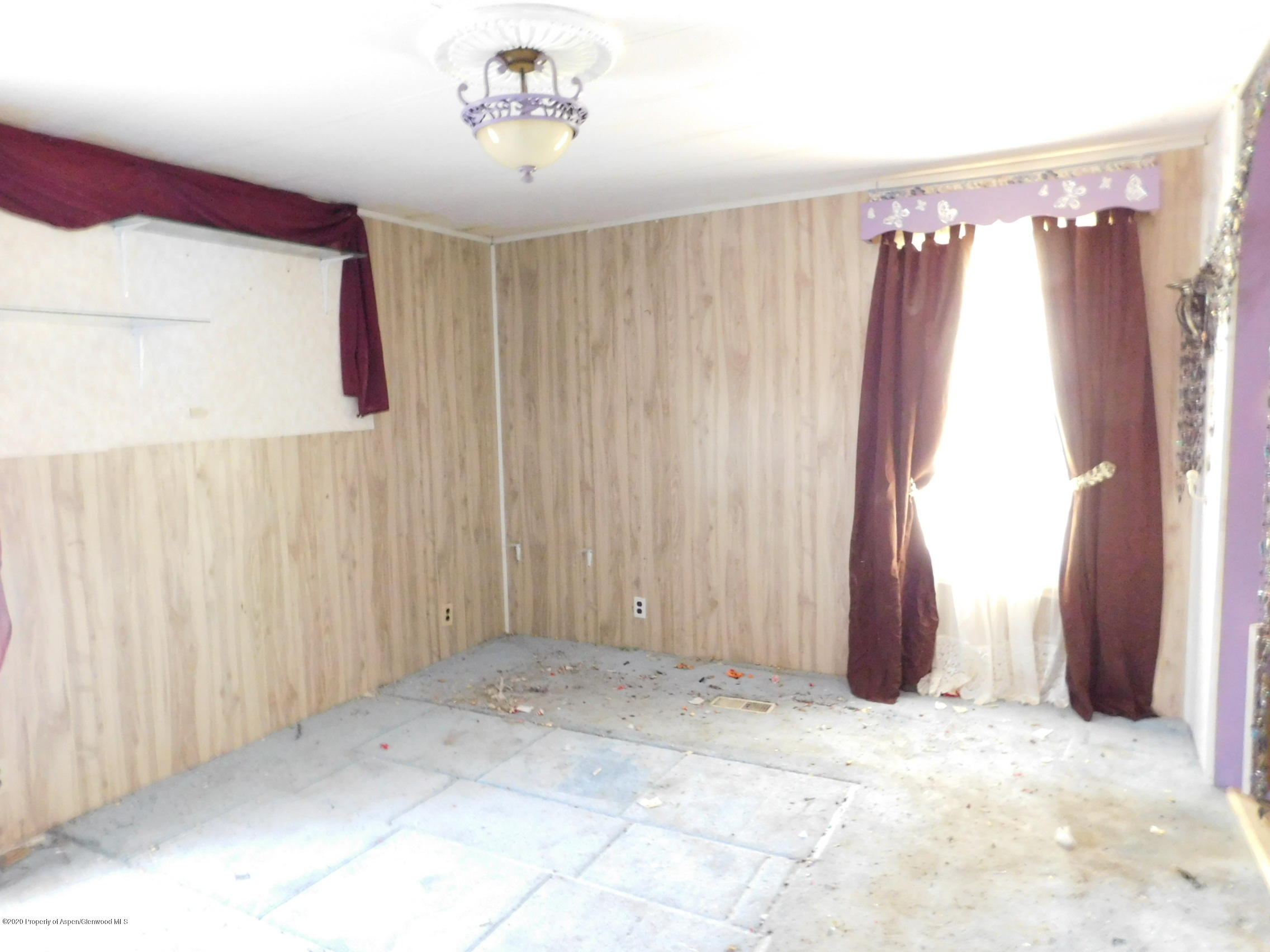 2235 Baker Drive Craig, CO 81625 - Photo 12 of 16 a view of a garage with a wooden door