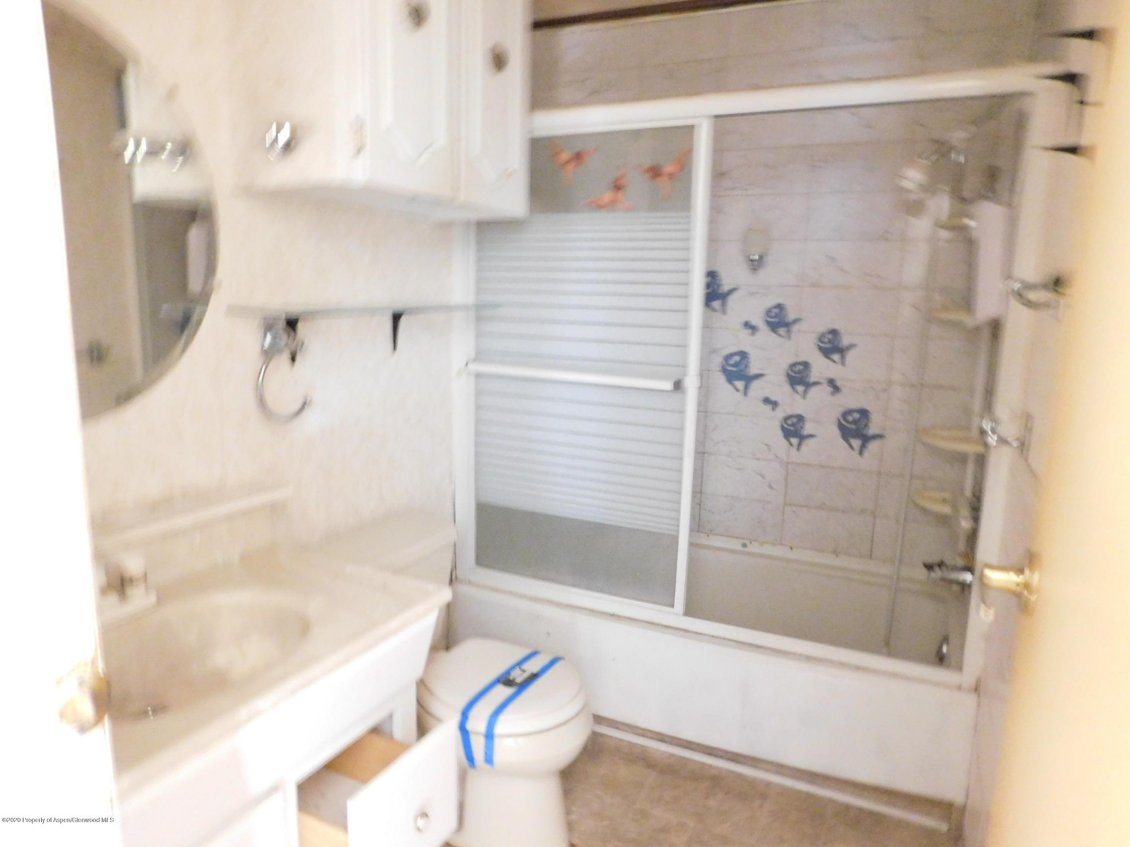 2235 Baker Drive Craig, CO 81625 - Photo 16 of 16 a bathroom with a bathtub and a shower