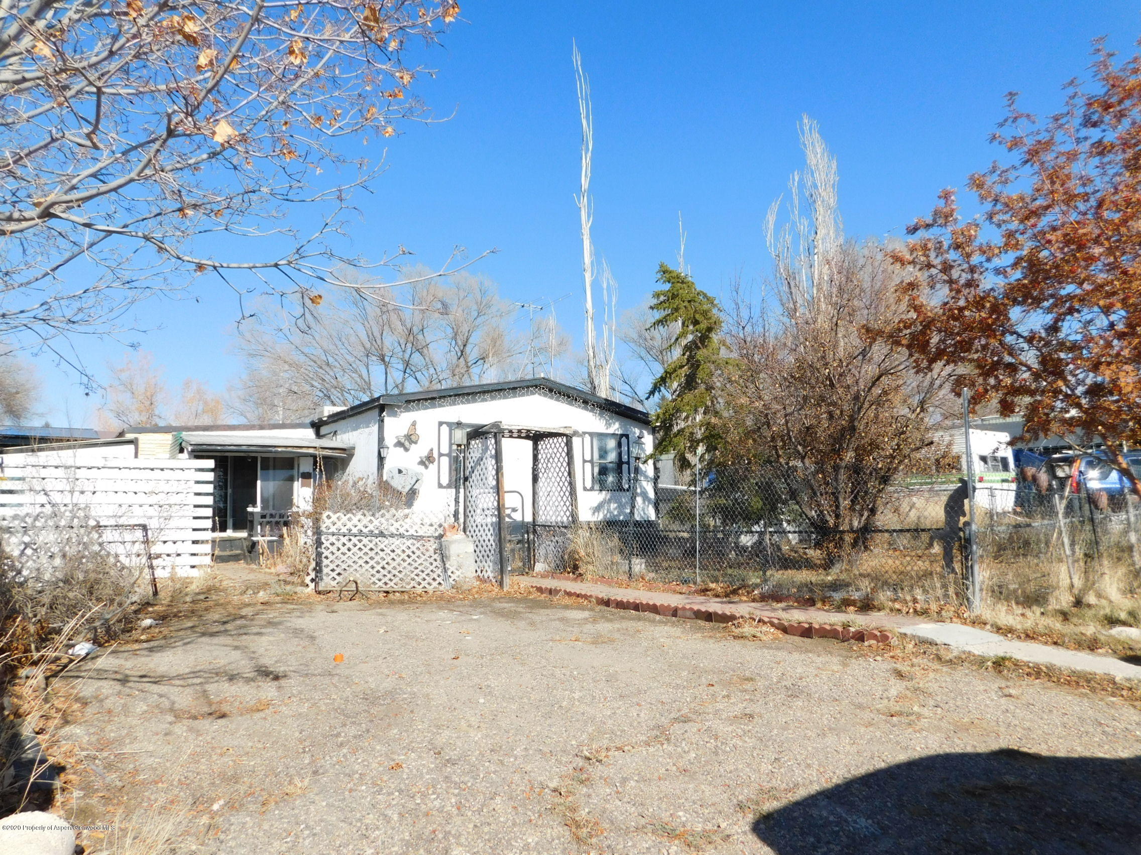 2235 Baker Drive Craig, CO 81625 - Photo 2 of 16 a view of a backyard with large trees