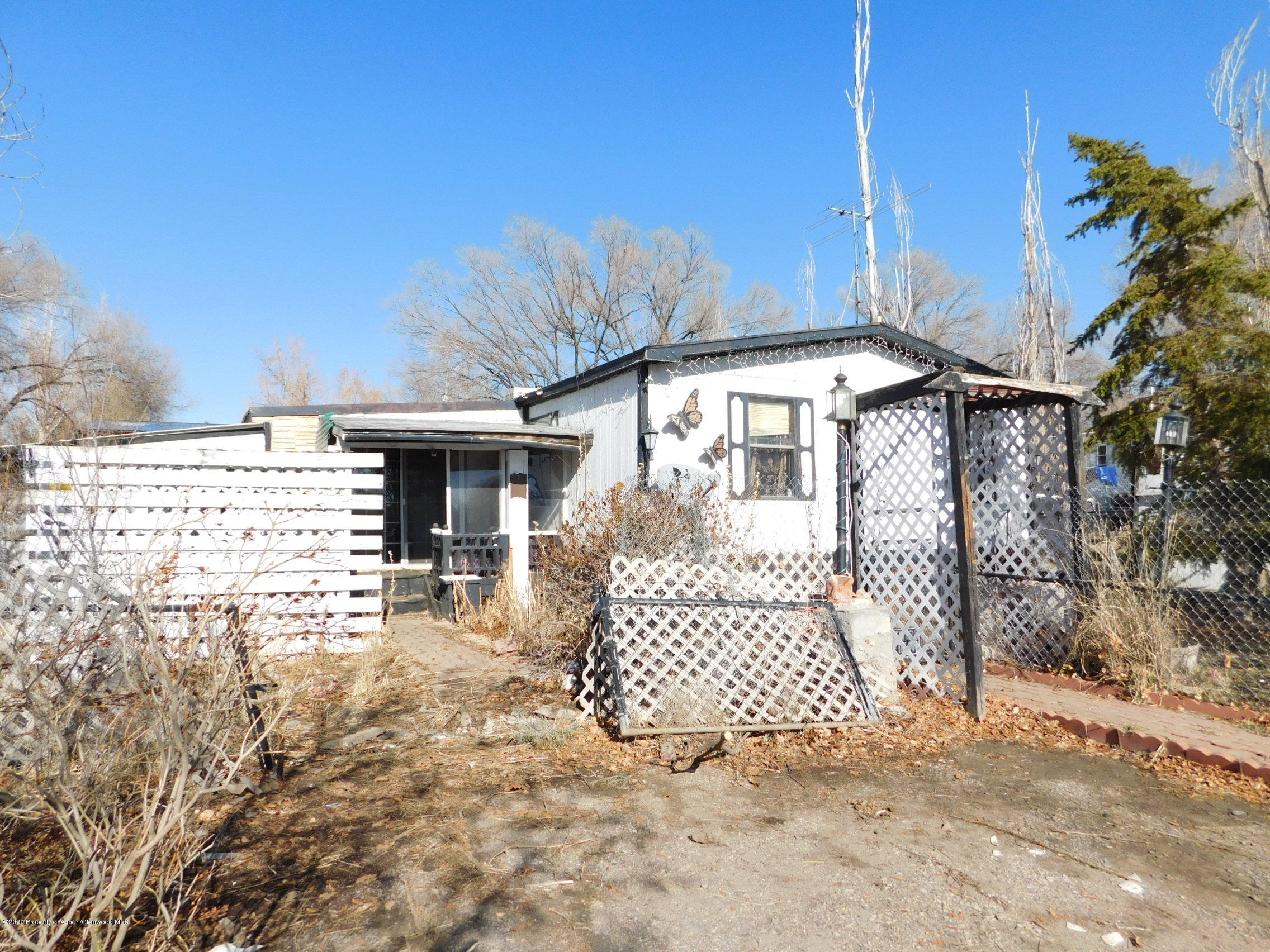 2235 Baker Drive Craig, CO 81625 - Photo 3 of 16 a front view of a house with a yard